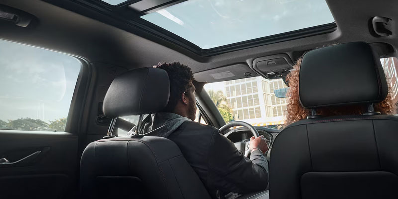 an interior shot of the 2025 Chevrolet Blazer with two people in the front seats